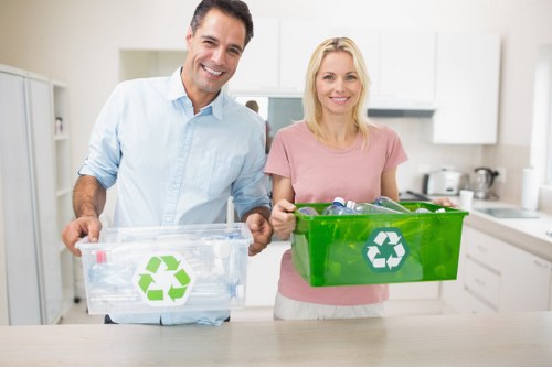 Workers sorting recyclable materials in a commercial recycling centre