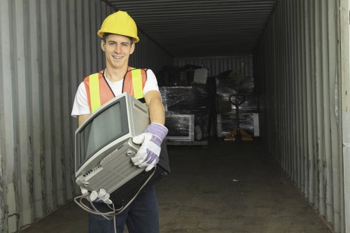 Community volunteers loading reusable furniture for charity pickup